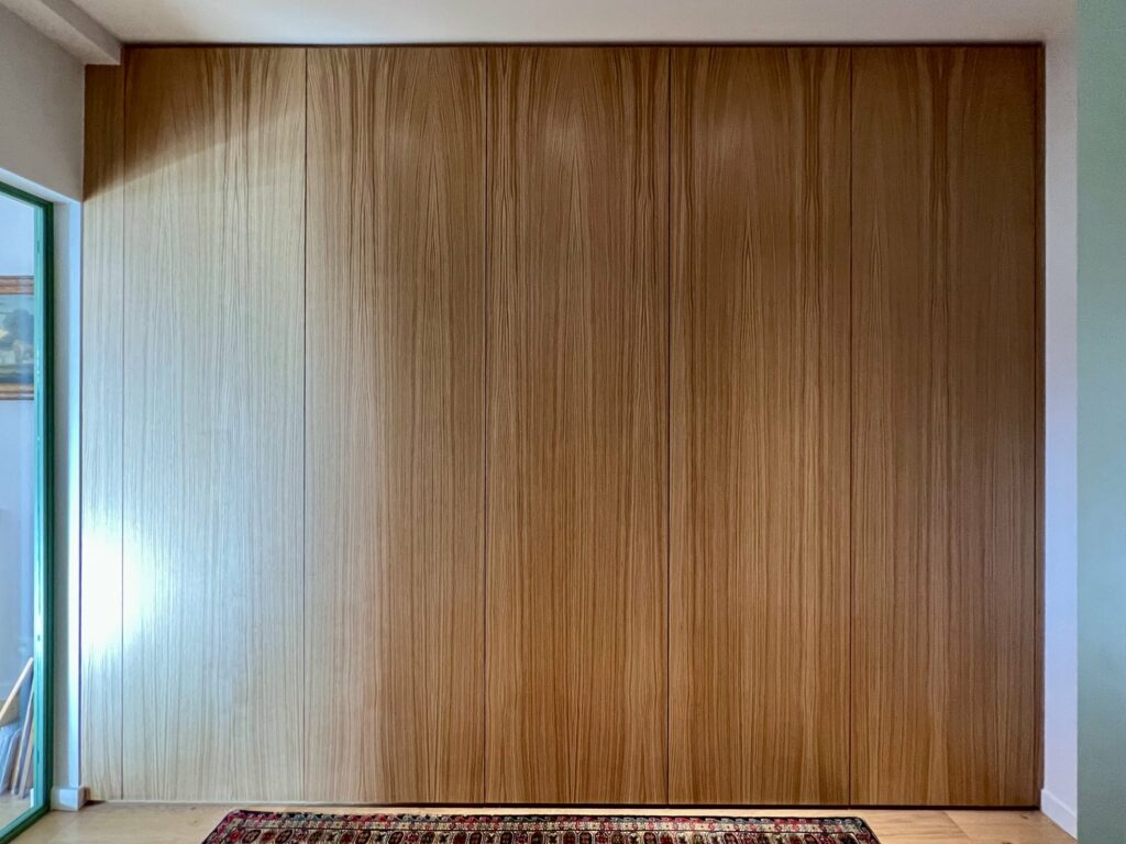 Full-height oak cupboard wall
